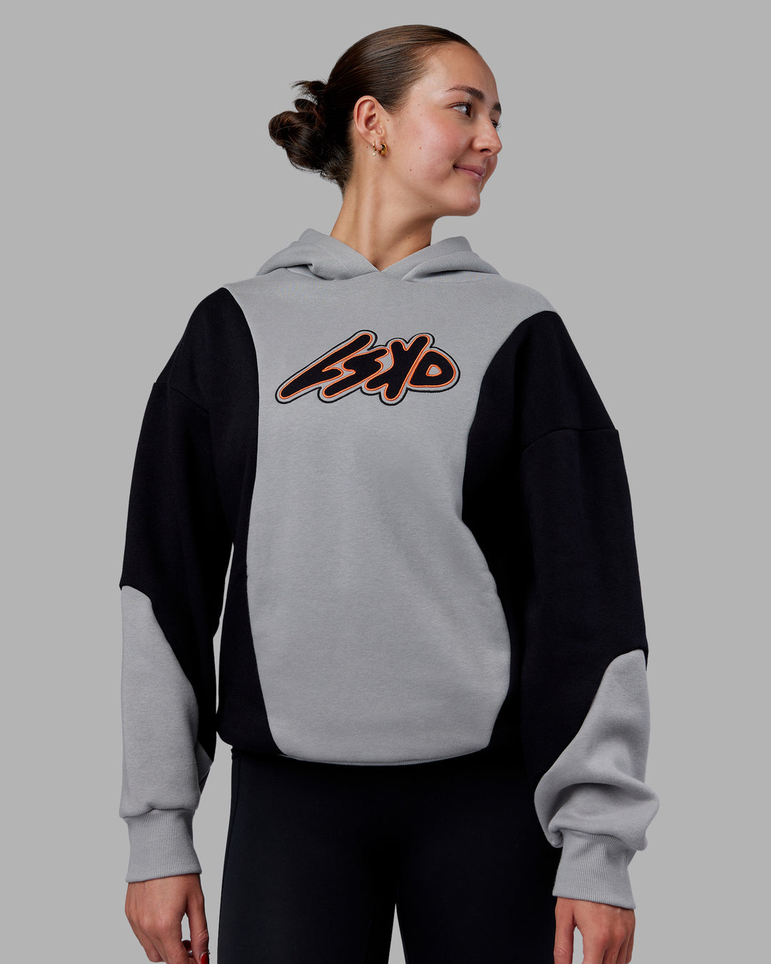 Woman wearing Downtown Oversized Panel Hoodie - Circular Grey - Black | Model:Remmi | Size:XS - view 3