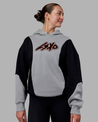 Woman wearing Downtown Oversized Panel Hoodie - Circular Grey - Black | Model:Remmi | Size:XS | Thumbnail Index: 2