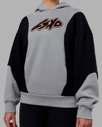 Woman wearing Downtown Oversized Panel Hoodie - Circular Grey - Black | Model:Remmi | Size:XS | Thumbnail Index: 7