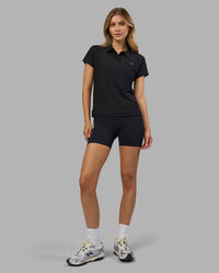 Woman wearing Drive Polo - Black | Model:Leilani| Size:XS | Thumbnail Index: 7
