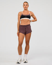 Man wearing Elevate Sports Bra - Black-Multi | Model:Maja | Size:XS | Thumbnail Index: 6
