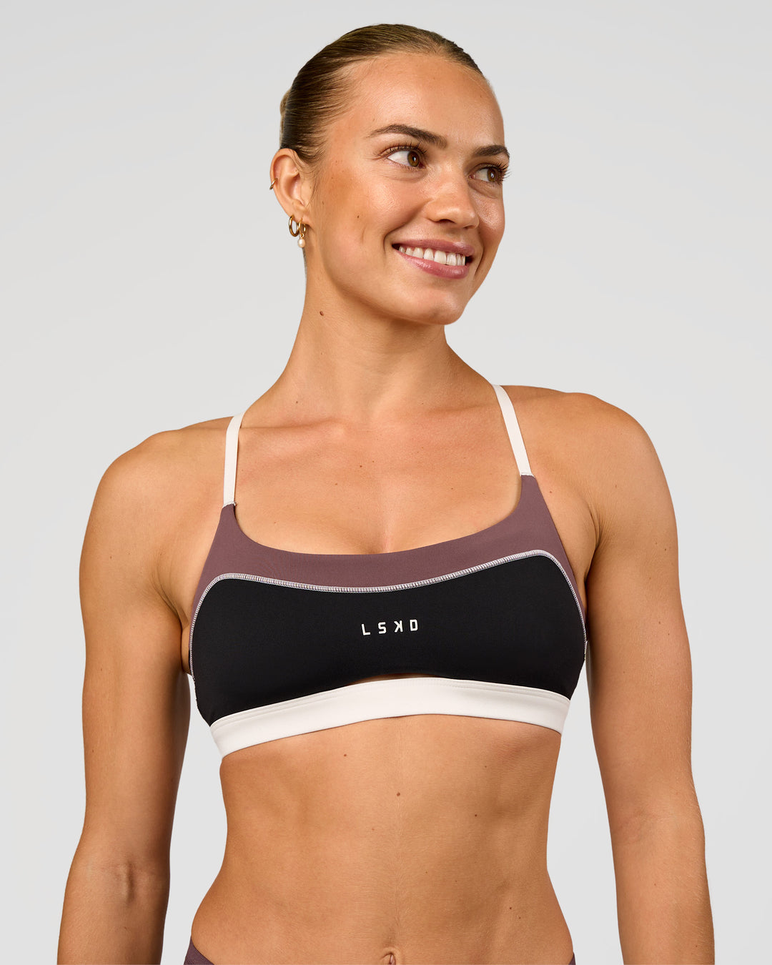 Man wearing Elevate Sports Bra - Black-Multi | Model:Maja | Size:XS - view 4