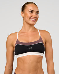 Man wearing Elevate Sports Bra - Black-Multi | Model:Maja | Size:XS | Thumbnail Index: 3