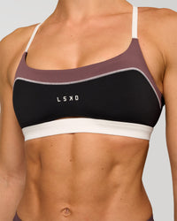 Man wearing Elevate Sports Bra - Black-Multi | Model:Maja | Size:XS | Thumbnail Index: 8