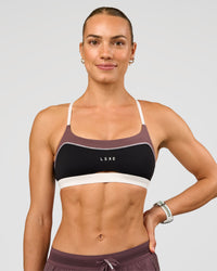 Man wearing Elevate Sports Bra - Black-Multi | Model:Maja | Size:XS | Thumbnail Index: 5