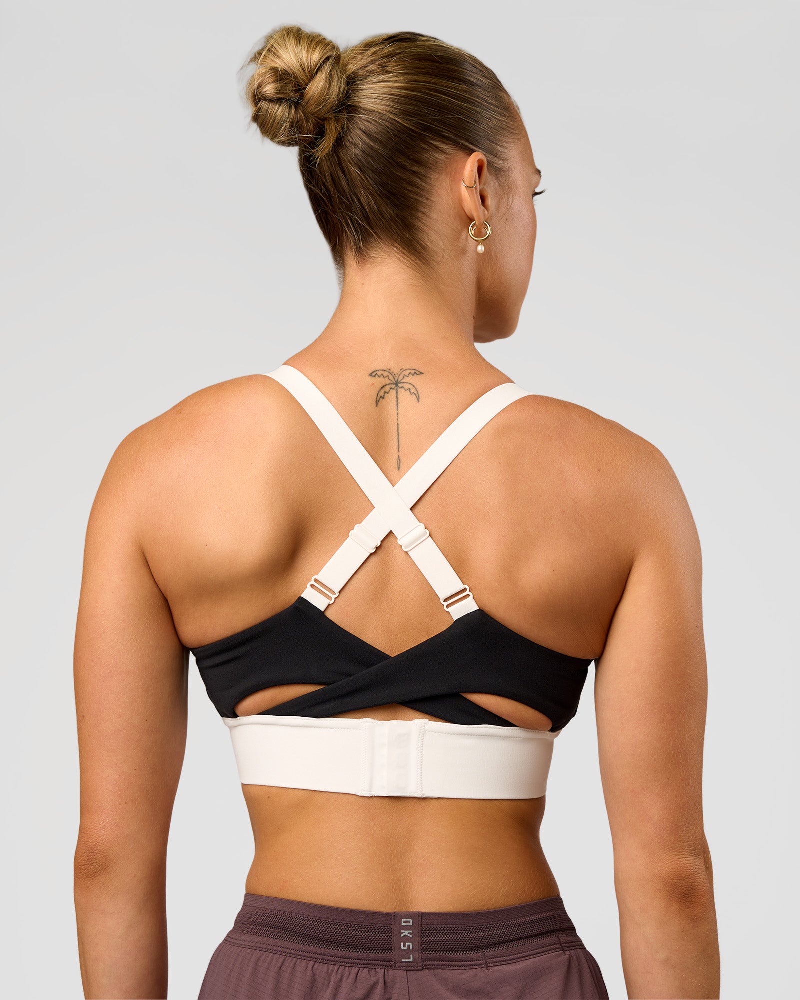 Woman wearing Elevated Accelerate Sports Bra - Black-Multi | Model:Maja | Size:XS