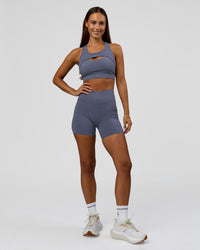 Woman wearing Elite Run High-Rise 5" Short Pockets - Night Shadow | Model:Brylee | Size:XS | Thumbnail Index: 5