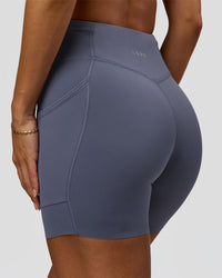 Woman wearing Elite Run High-Rise 5" Short Pockets - Night Shadow | Model:Brylee | Size:XS | Thumbnail Index: 0