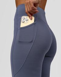 Woman wearing Elite Run High-Rise Full Length Legging Pockets - Night Shadow | Model:Brylee | Size:XS | Thumbnail Index: 2