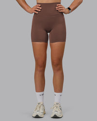 Woman wearing Elixir Ultra High-Rise 6" Short Pockets - Chocolate Martini | Model:Chloe | Size:XS | Thumbnail Index: 5
