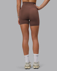 Woman wearing Elixir Ultra High-Rise 6" Short Pockets - Chocolate Martini | Model:Chloe | Size:XS | Thumbnail Index: 3
