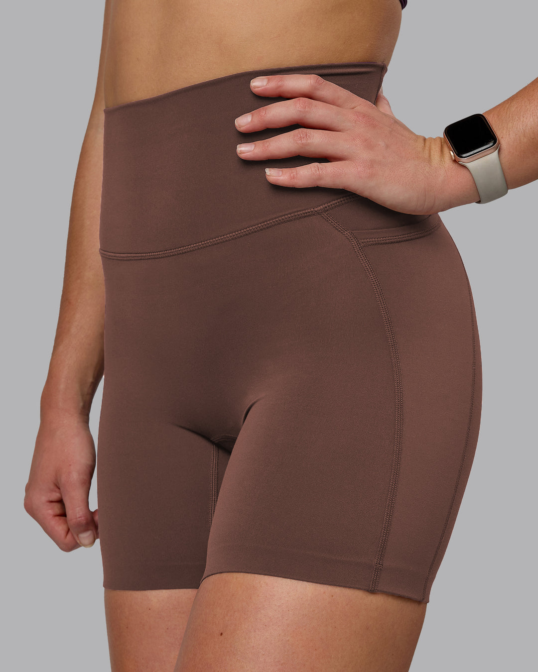 Woman wearing Elixir Ultra High-Rise 6" Short Pockets - Chocolate Martini | Model:Chloe | Size:XS - view 1