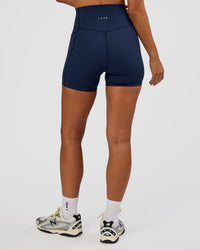 Woman wearing Elixir Ultra High-Rise 4" Short Pockets - Future Navy | Model:Brylee | Size:XS | Thumbnail Index: 3