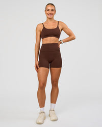 Woman wearing Elixir Ultra High-Rise 4" Short Pockets - Hot Chocolate | Model:Maja | Size:XS | Thumbnail Index: 4