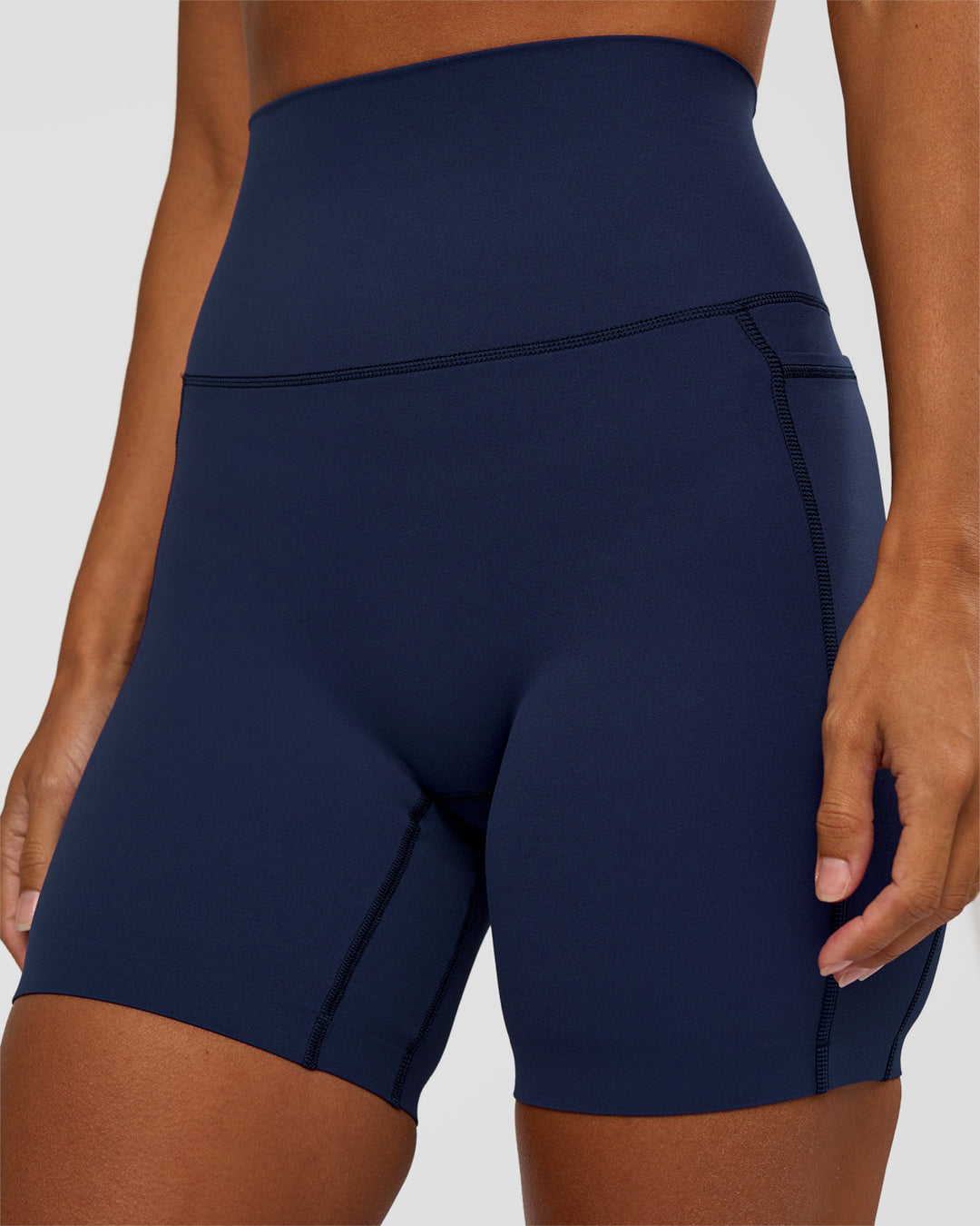 Woman wearing Elixir Ultra High-Rise 6” Short Pockets - Future Navy | Model:Brylee | Size:XS - view 5