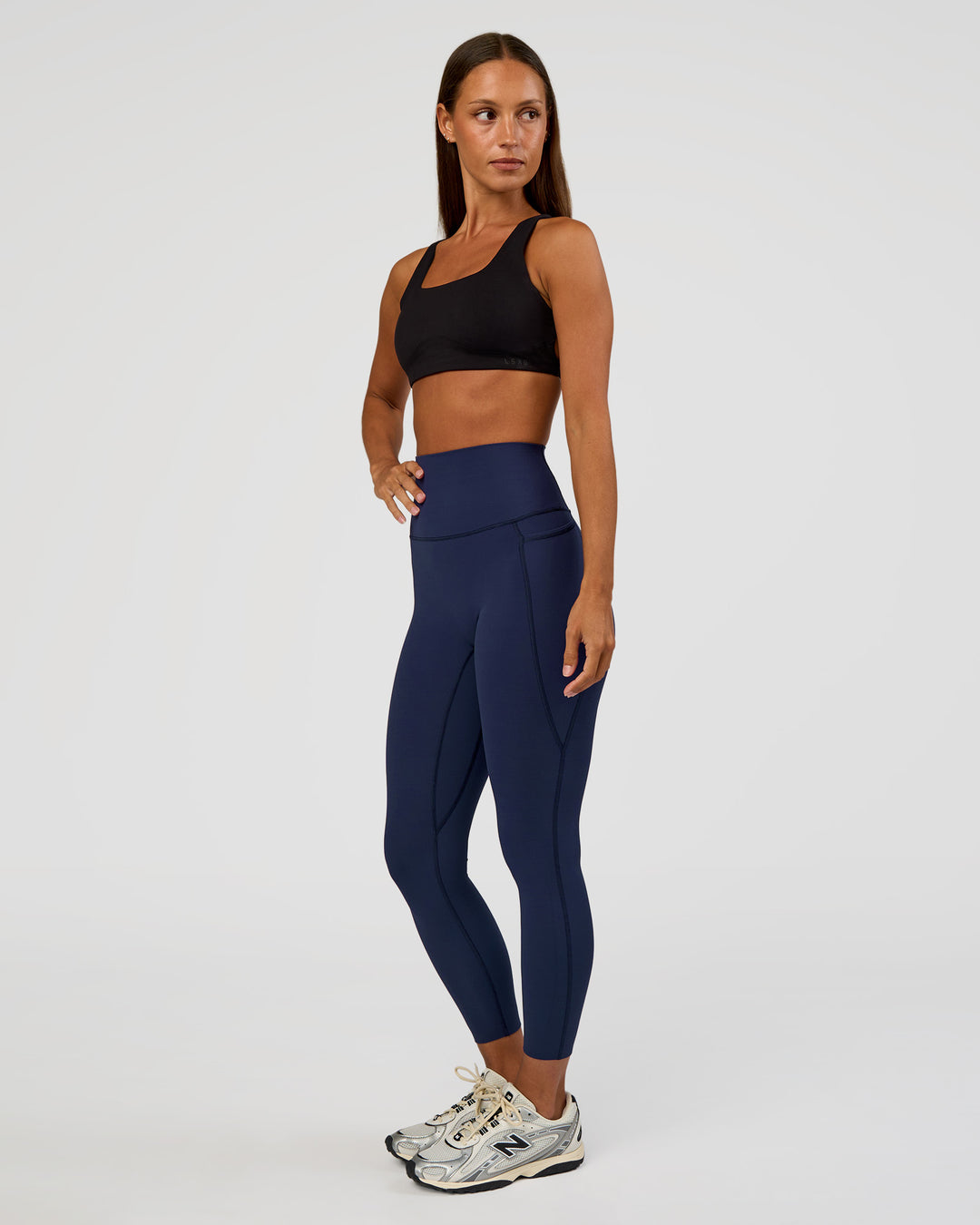Woman wearing Elixir Ultra High-Rise 7/8 Legging Pockets - Future Navy | Model:Brylee | Size:XS - view 7