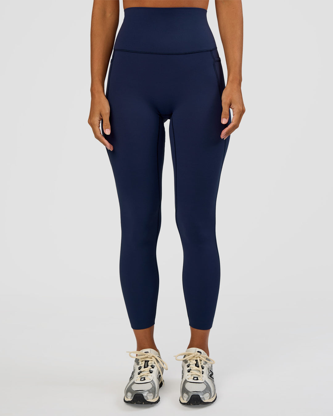 Woman wearing Elixir Ultra High-Rise 7/8 Legging Pockets - Future Navy | Model:Brylee | Size:XS - view 1