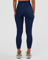 Woman wearing Elixir Ultra High-Rise 7/8 Legging Pockets - Future Navy | Model:Brylee | Size:XS | Thumbnail Index: 3