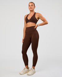 Woman wearing Elixir Ultra High-Rise 7/8 Legging Pockets - Hot Chocolate | Model:Maja | Size:XS | Thumbnail Index: 0