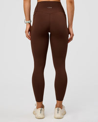 Woman wearing Elixir Ultra High-Rise 7/8 Legging Pockets - Hot Chocolate | Model:Maja | Size:XS | Thumbnail Index: 3