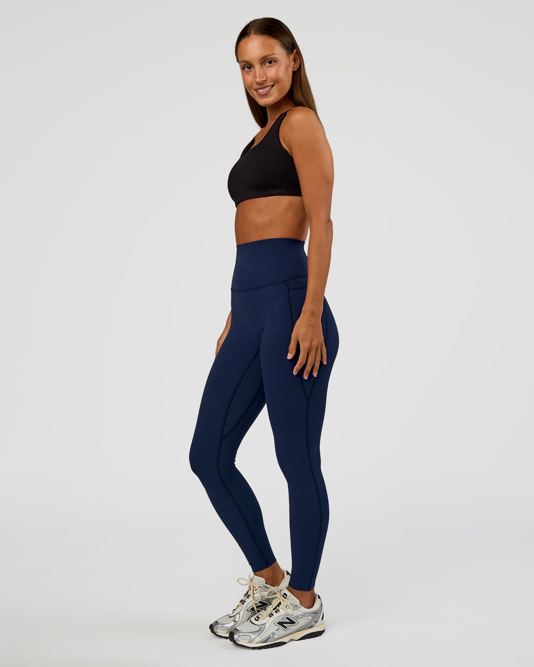 Woman wearing Elixir Ultra High-Rise Full Length Legging Pockets - Future Navy | Model:Brylee | Size:XS - view 6