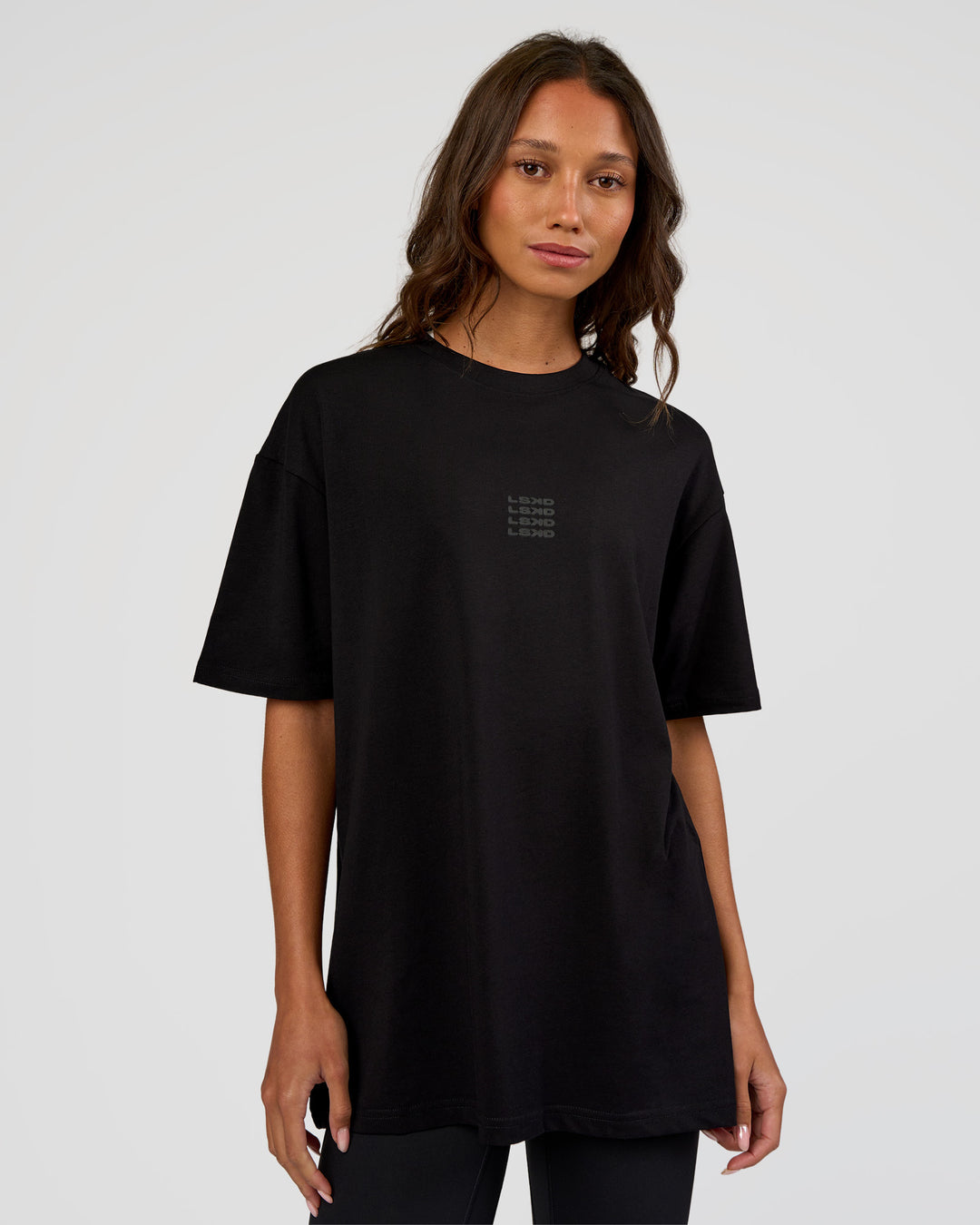 Woman wearing Everyday Elevation FLXCotton Oversized Tee - Black-Black | Model:Dakota | Size:XS - view 5