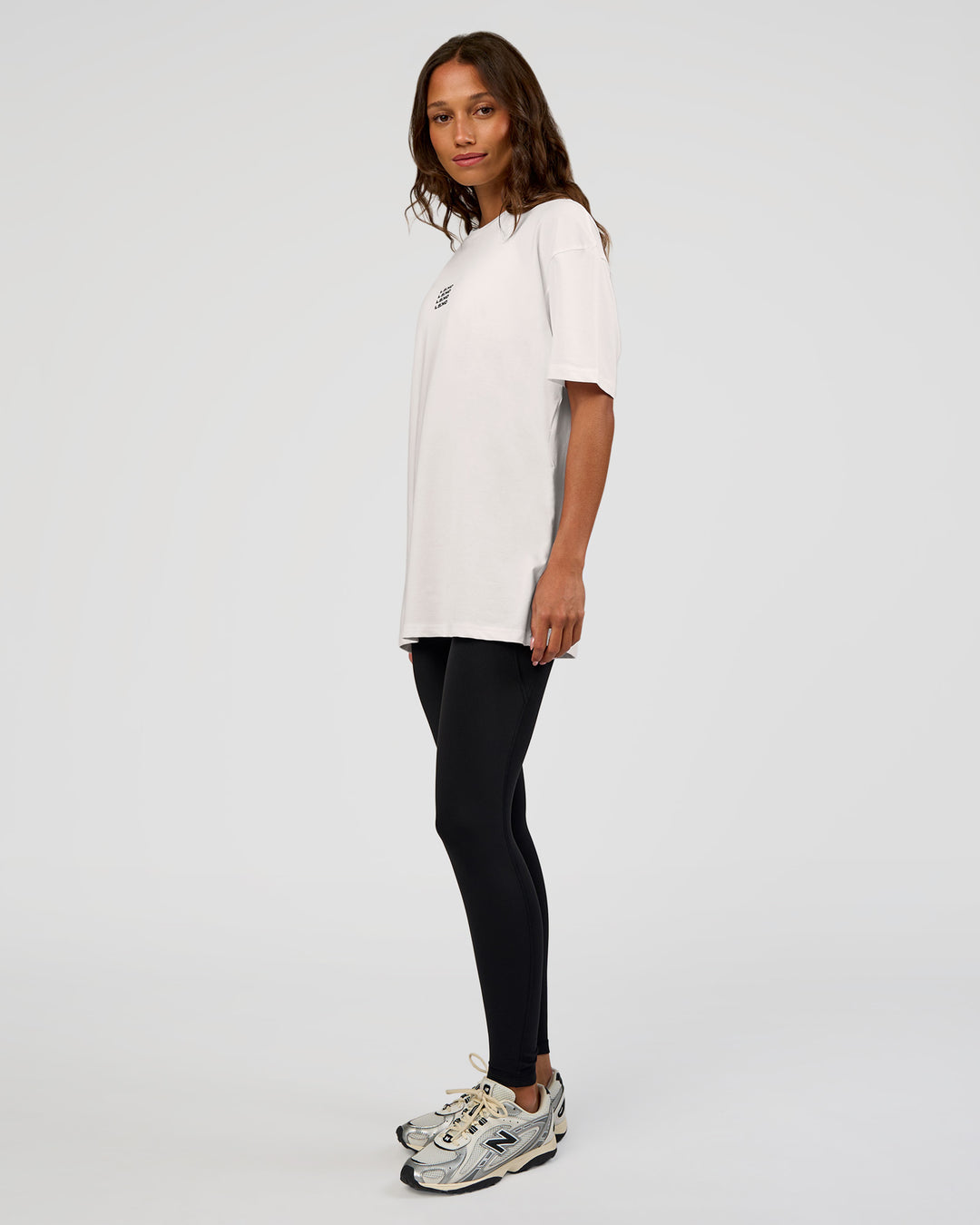 Woman wearing Everyday Elevation FLXCotton Oversized Tee - White-Carbon Green | Model:Dakota | Size:XS - view 10