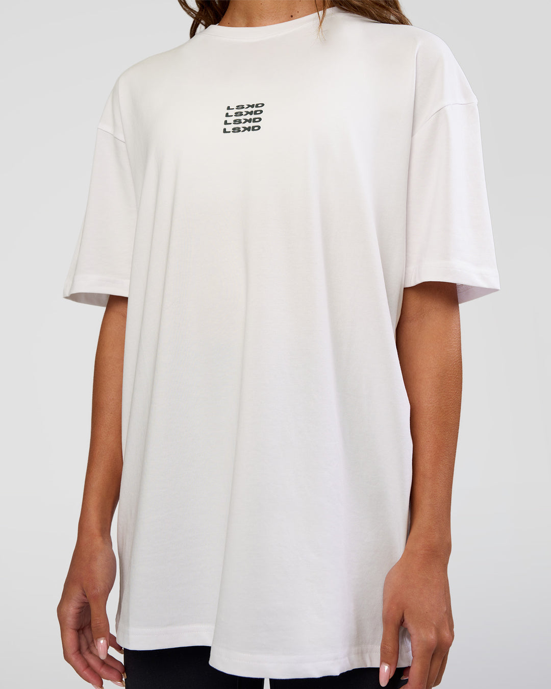 Woman wearing Everyday Elevation FLXCotton Oversized Tee - White-Carbon Green | Model:Dakota | Size:XS - view 12