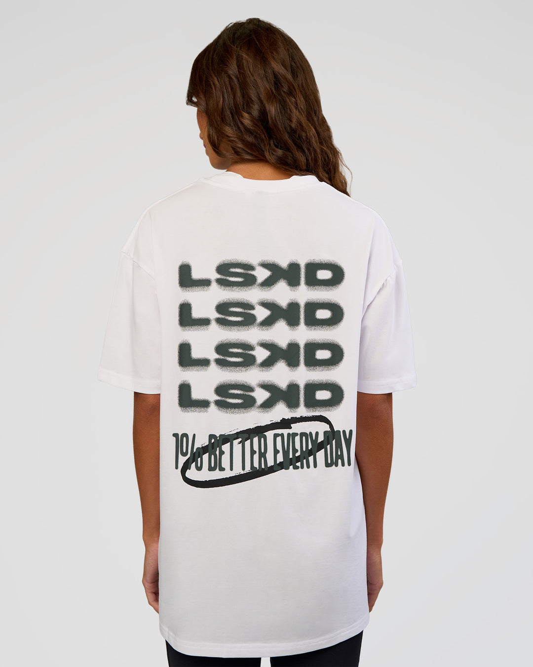 Woman wearing Everyday Elevation FLXCotton Oversized Tee - White-Carbon Green | Model:Dakota | Size:XS - view 13