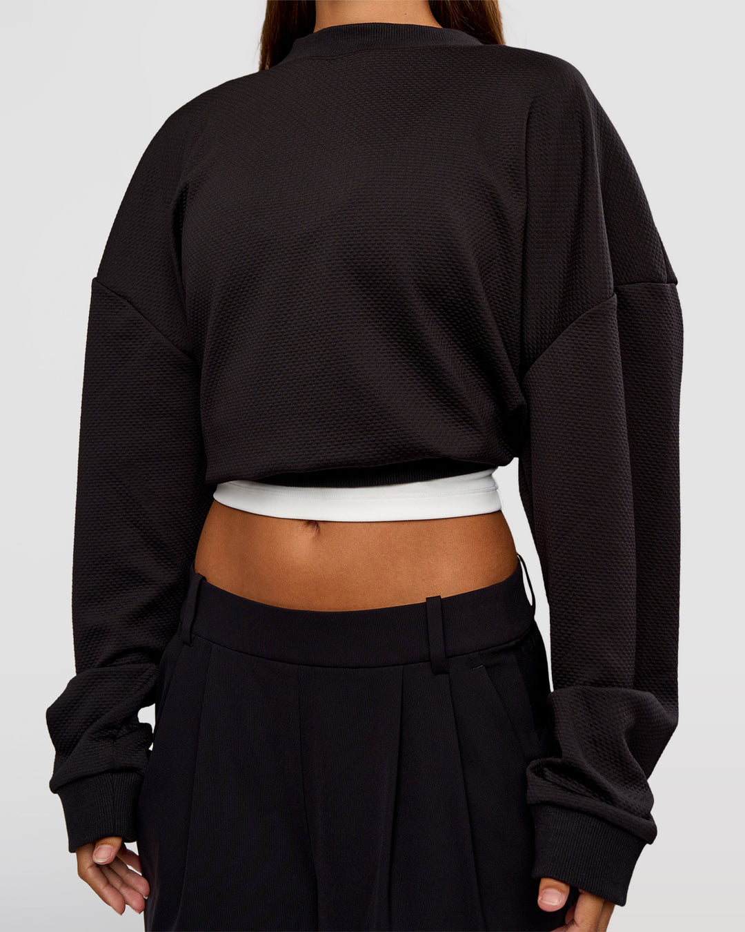 Woman wearing Everyday Elevation Waffle Oversized Sweater - Black | Model:Brylee | Size:XS - view 10