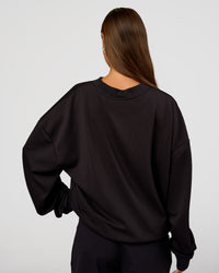 Woman wearing Everyday Elevation Waffle Oversized Sweater - Black | Model:Brylee | Size:XS | Thumbnail Index: 11