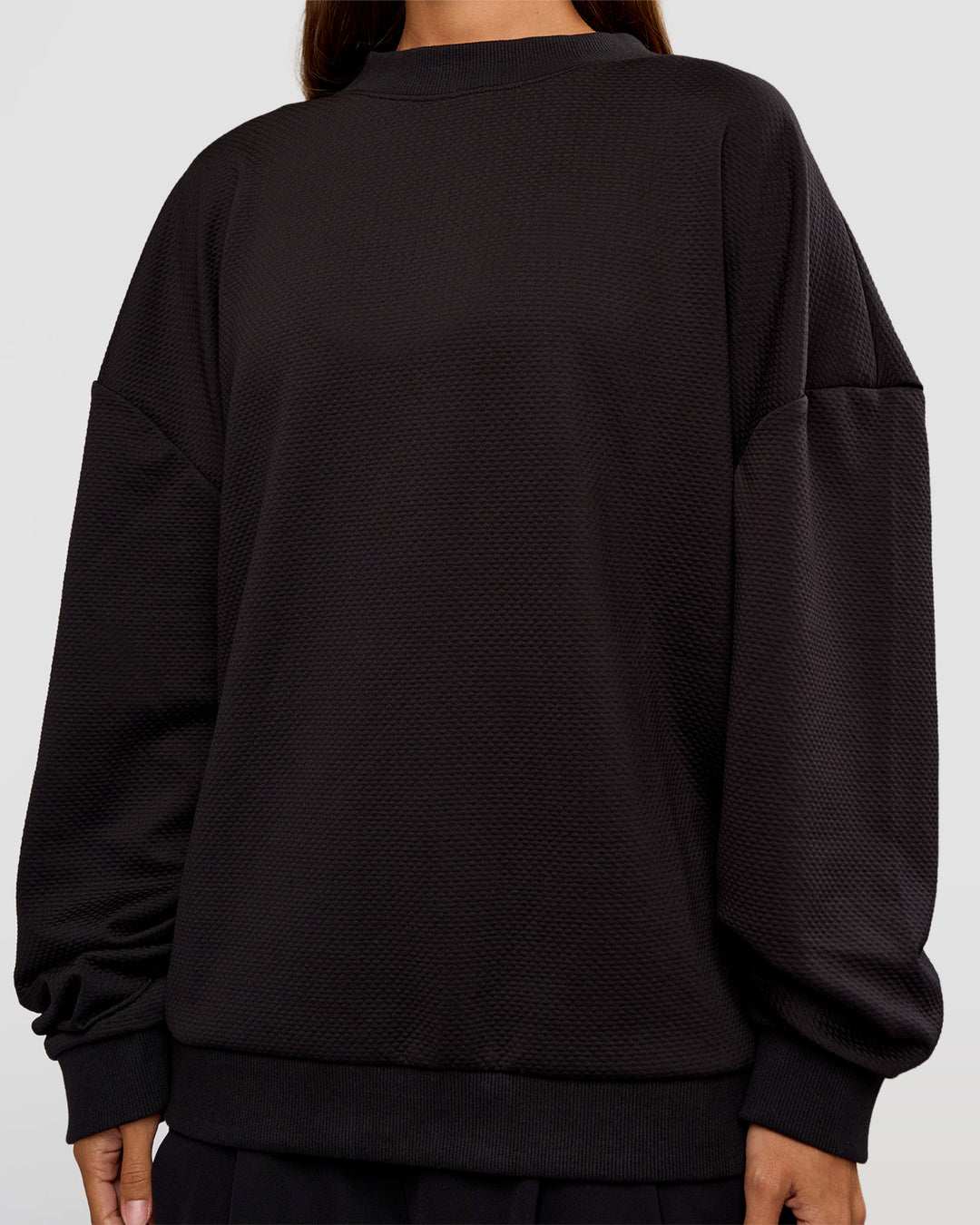 Woman wearing Everyday Elevation Waffle Oversized Sweater - Black | Model:Brylee | Size:XS - view 13