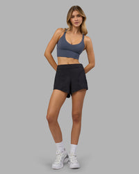 Woman wearing Flash Longline Sports Bra - Night Shadow | Model:Leilani | Size:XS | Thumbnail Index: 4