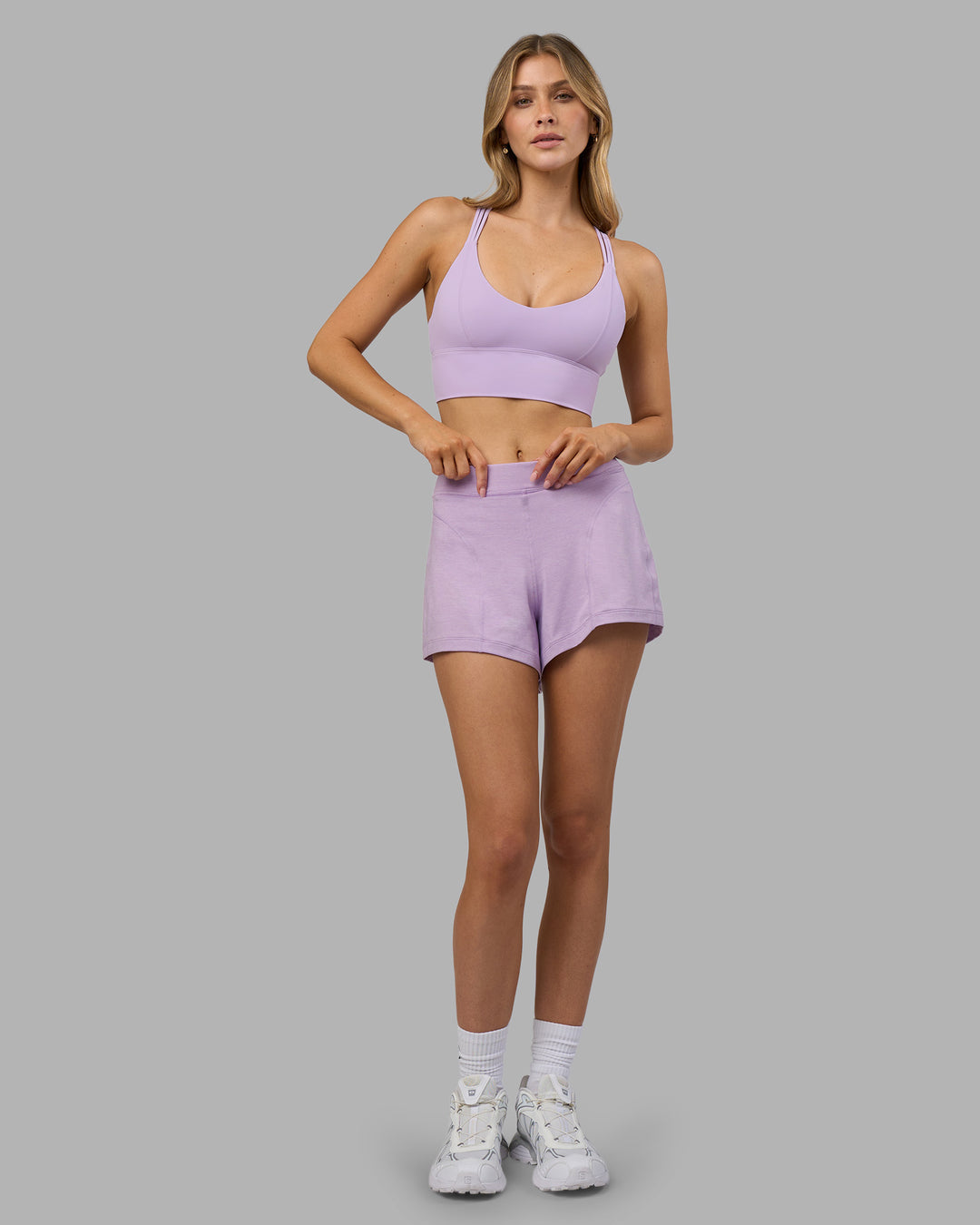 Woman wearing Flash Longline Sports Bra - Pale Lilac | Model:Leilani | Size:XS - view 6