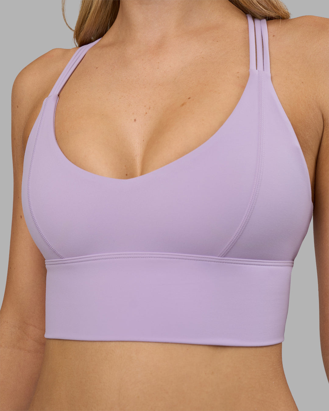 Woman wearing Flash Longline Sports Bra - Pale Lilac | Model:Leilani | Size:XS - view 5