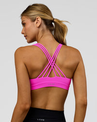 Woman wearing Flash Sports Bra - Ultra Fuchsia | Model:Leilani | Size:XS | Thumbnail Index: 1