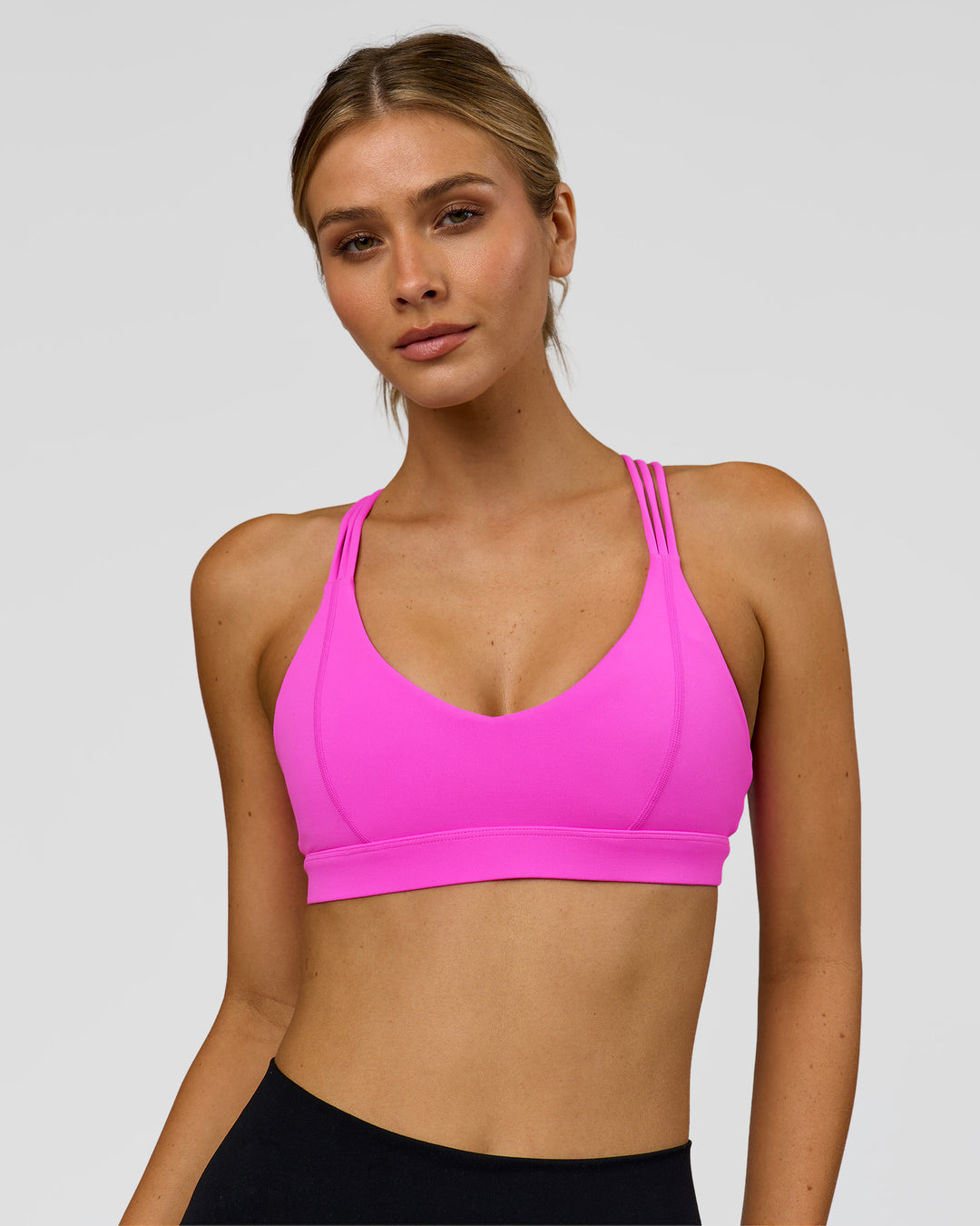 Woman wearing Flash Sports Bra - Ultra Fuchsia | Model:Leilani | Size:XS - view 1