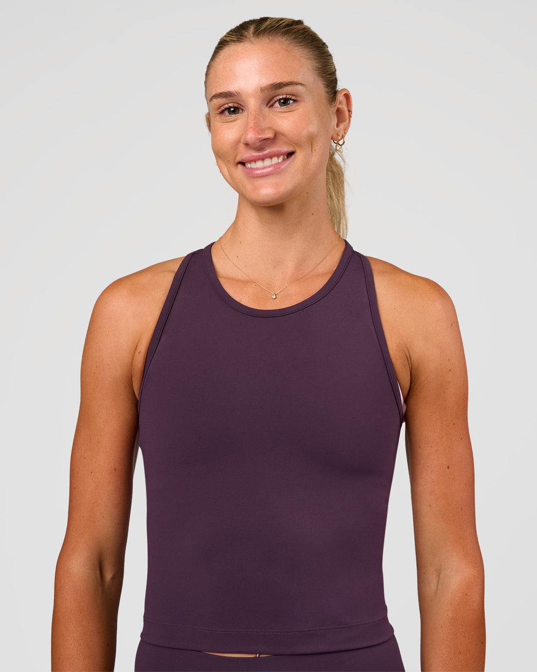 Woman wearing Flow Performance Tank 2.0 - Midnight Plum | Model:Emelia | Size:XS - view 2