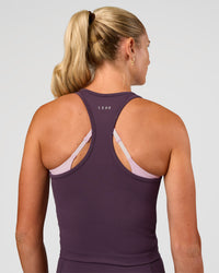 Woman wearing Flow Performance Tank 2.0 - Midnight Plum | Model:Emelia | Size:XS | Thumbnail Index: 2