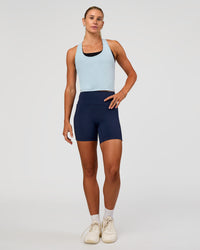 Woman wearing Flow Scoop Neck Performance Tank - Blue Aura | Model:Emelia | Size:XS | Thumbnail Index: 4