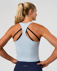 Woman wearing Flow Scoop Neck Performance Tank - Blue Aura | Model:Emelia | Size:XS | Thumbnail Index: 1
