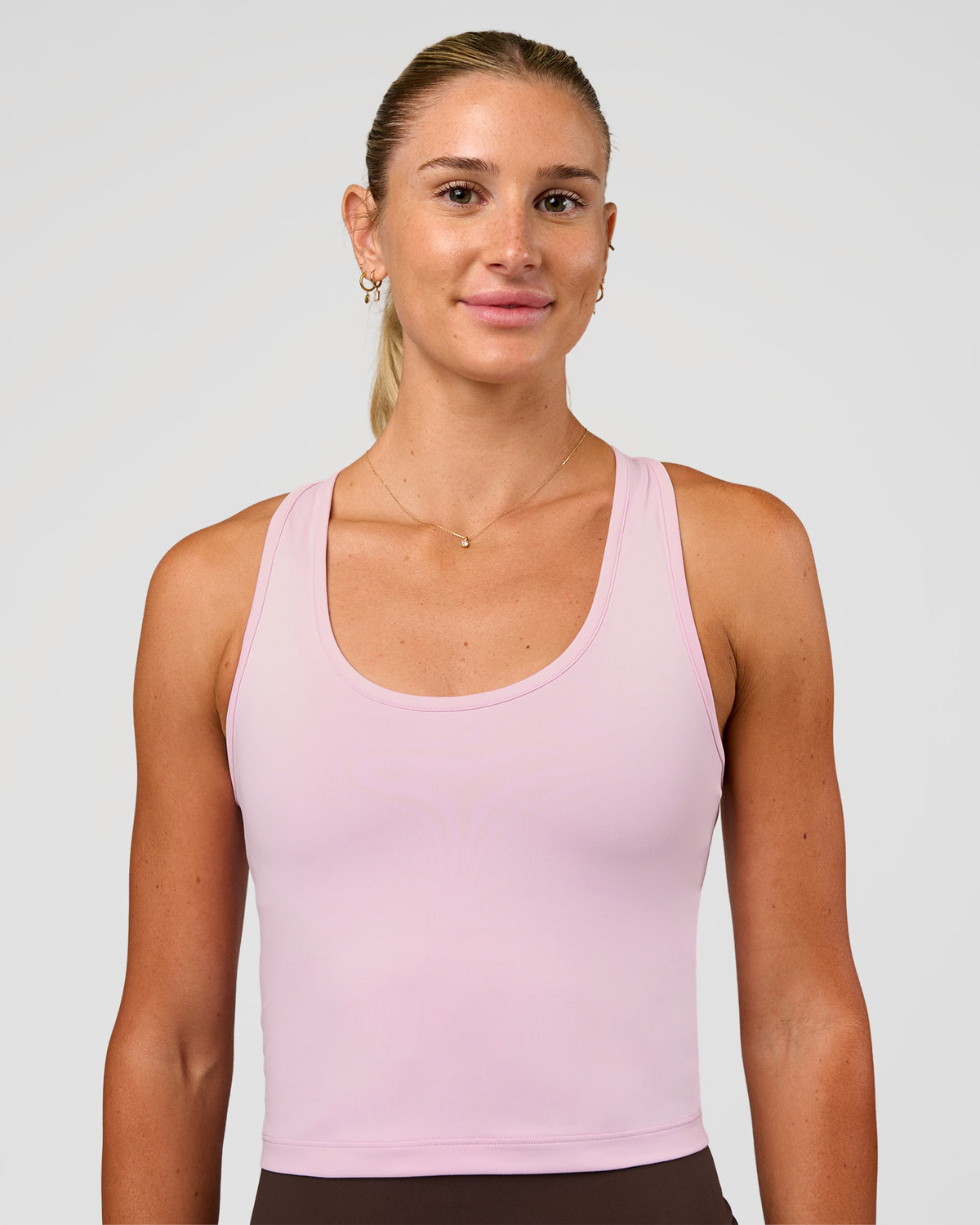 Woman wearing Flow Scoop Neck Performance Tank - Marshmallow | Model:Emelia | Size:XS
