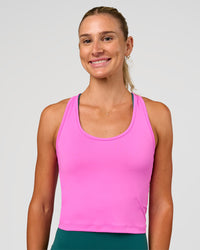 Woman wearing Flow Scoop Neck Performance Tank - Ultra Fuchsia | Model:Emelia | Size:XS | Thumbnail Index: 0