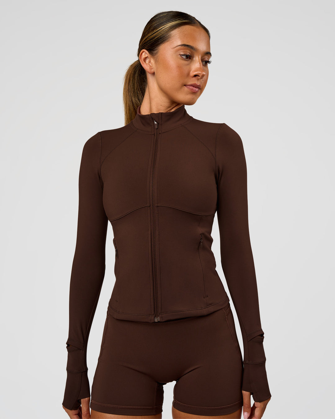 Woman wearing Fusion Active Jacket - Hot Chocolate | Model:Charli | Size:XS - view 8