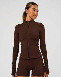 Woman wearing Fusion Active Jacket - Hot Chocolate | Model:Charli | Size:XS | Thumbnail Index: 7