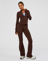 Woman wearing Fusion Active Jacket - Hot Chocolate | Model:Charli | Size:XS | Thumbnail Index: 2