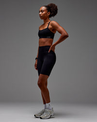 Woman wearing Fusion Ultra High-Rise 9" Short Pockets - Black | Model:Txai | Size:XS | Thumbnail Index: 20