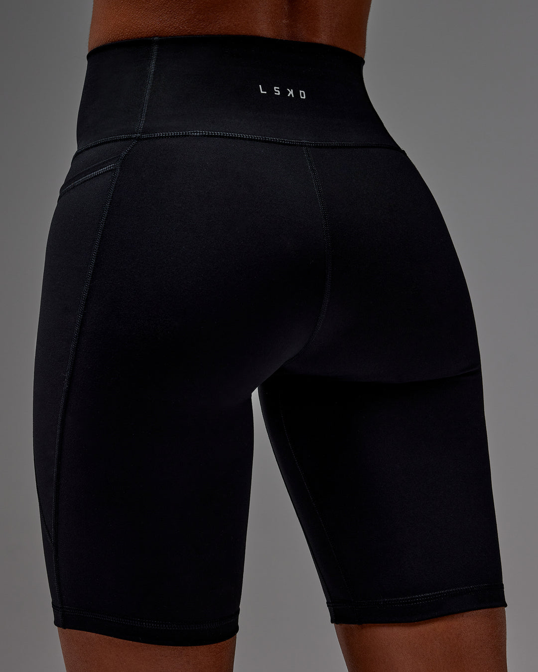 Woman wearing Fusion Ultra High-Rise 9" Short Pockets - Black | Model:Txai | Size:XS - view 23