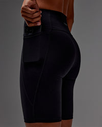Woman wearing Fusion Ultra High-Rise 9" Short Pockets - Black | Model:Txai | Size:XS | Thumbnail Index: 18