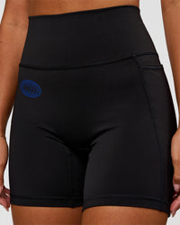Woman wearing Fusion Hype Graphic Ultra High-Rise 6" Short Pockets - Black-Electric Indigo | Model:Charli | Size:XS | Thumbnail Index: 5